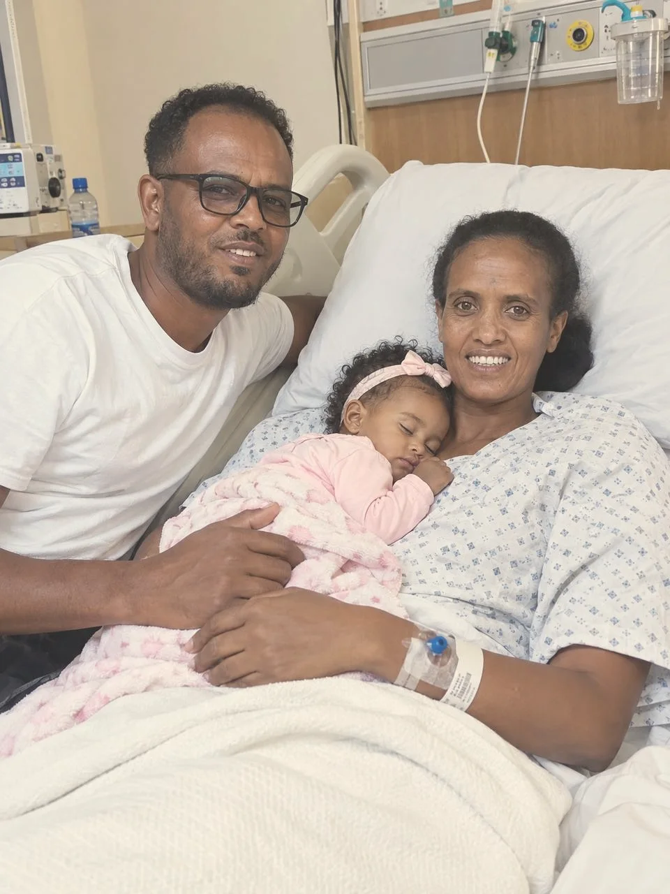 Abebe and Tirsit with the little one at the hospital